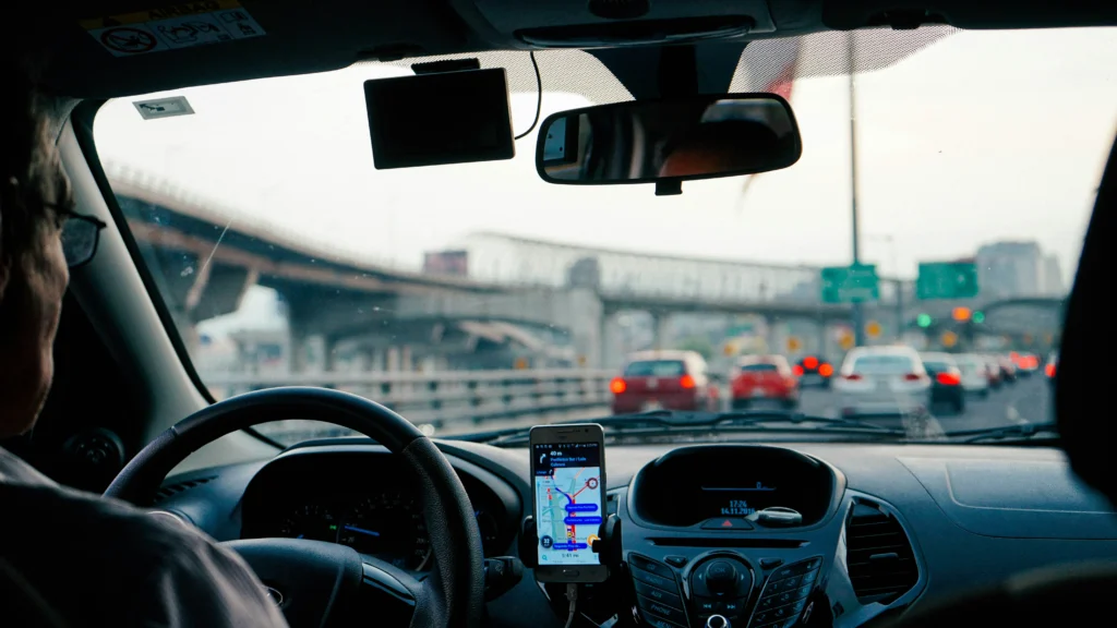 Driver practicing defensive driving techniques by scanning surrounding traffic