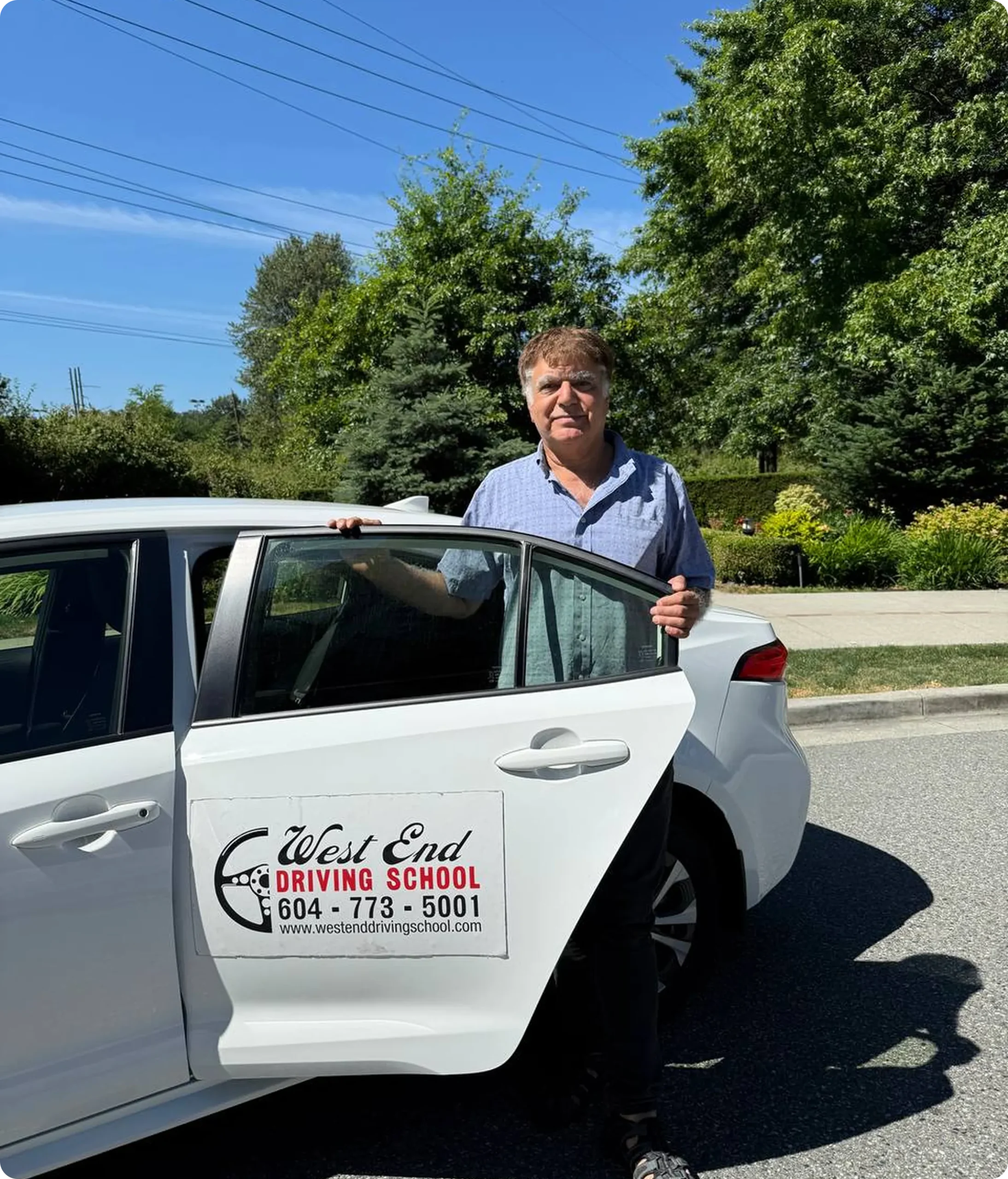 Local instructor beside training car to book driving lessons vancouver
