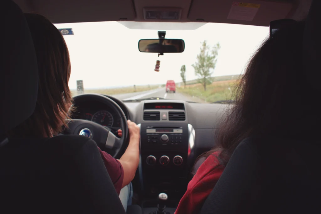 Learner driver maintaining a safe following distance using defensive driving techniques