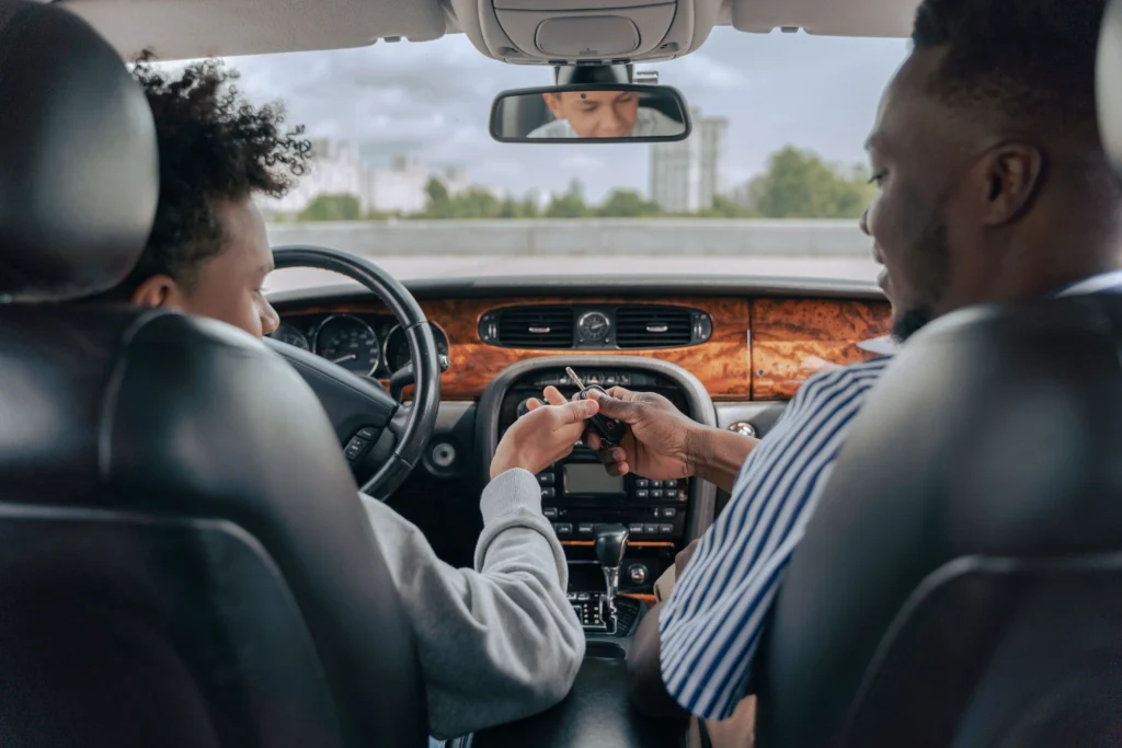Successful learner celebrating after avoiding road test mistakes